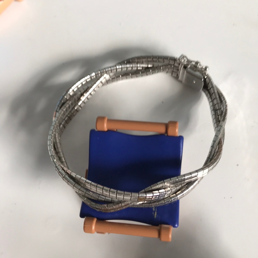 Sterling silver tri strand twisted bracelet light